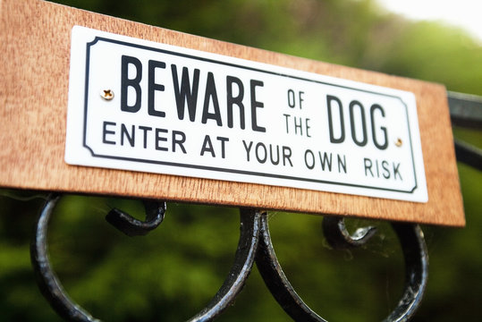 Beware Of The Dog Sign On Garden Gate