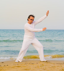 Man in white on a beach