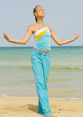 Woman exercising on a beach