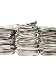 Three piles of newspapers