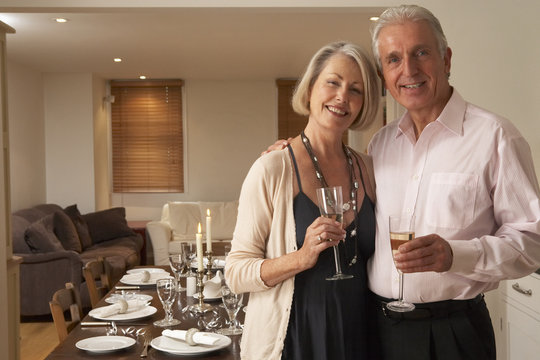 Couple Throwing A Dinner Party