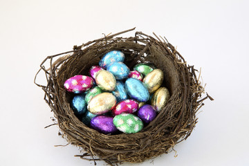 Birds nest of foil wrapped chocolate eggs