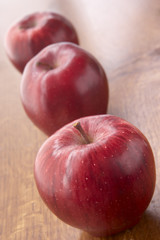 Fresh Red Apples Sitting On Bench