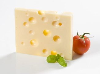 Slice of hard cheese and a tomato