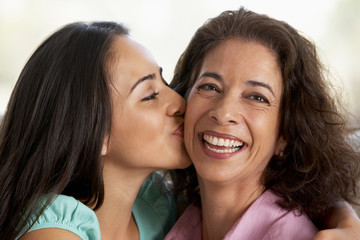 Fototapeta na wymiar Mother And Daughter Together At Home