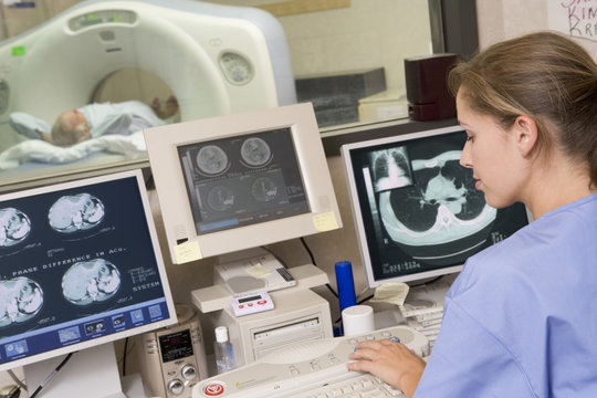 Nurse Monitoring Patient Having A Computerized Axial Tomography