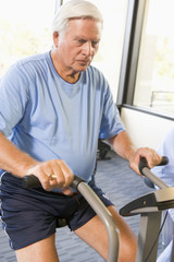 Patient Working Out On Exercise Machine