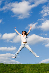Obraz premium pretty young woman is jumping