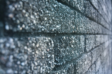 Texture of sandy brick wall in perspective in blue light