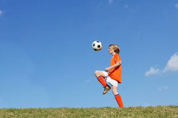 kid or boy playing soccer or football - 12976634