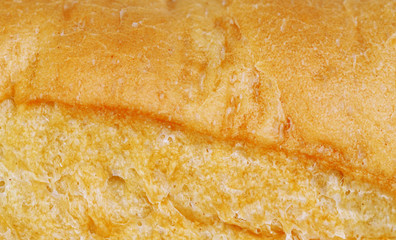 Crust of bread. Baguette. Close-up. Texture.