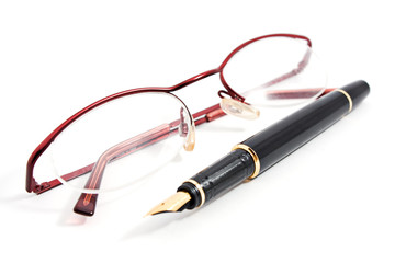 glass and office fountain pen on white background