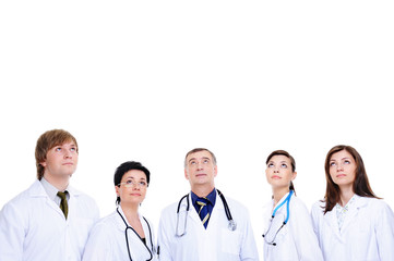 Fototapeta premium several medical doctors in hospital gown looking up