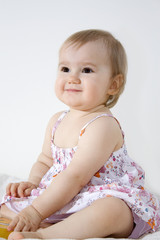 Smiling baby girl in the sundress