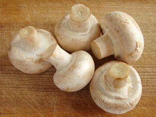 some mushrooms on the kitchen board