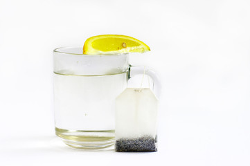 Hot water with a lemon and tea bag