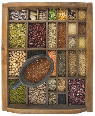 scoop of red quinoa and a variety of beans, grain, seeds