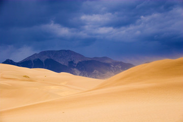 Fototapeta na wymiar Thunderstorm over sand dunes