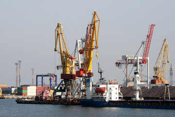 Fototapeta na wymiar dry-cargo ship at a mooring of trading port