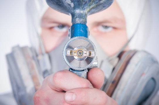 Worker with airbrush gun, selective focus