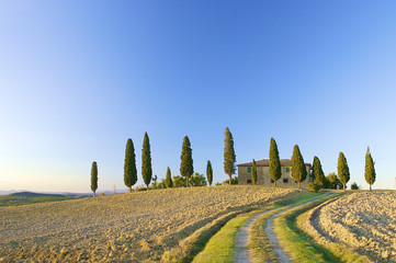 a typical Tuscan landscape in Italy with a Tuscan villa - 13004671