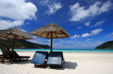 Chairs on a beautiful tropical island beach - 13015622