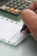 Signing a credit card sales receipt