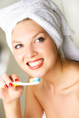 beautiful woman brushing teeth