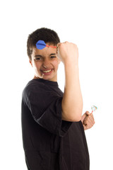 teenage boy cheers playing darts
