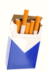 Cigarettes in open pack on white