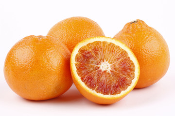 blood oranges on white