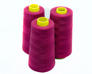 red purple cotton spools used in textile and fashion industry
