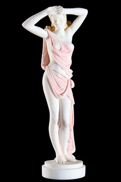 Classic painted marble statue of a woman isolated on black