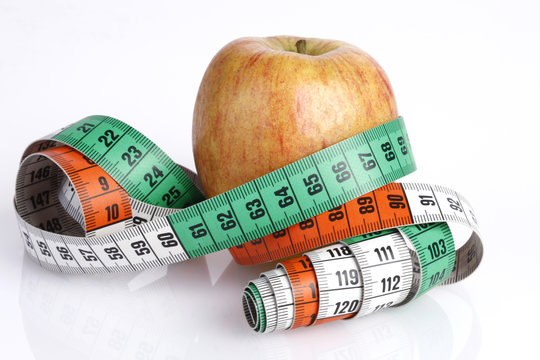 apple with tape measure - concept for dieting