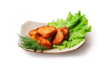 Fried meat with salad and dill in squared plate