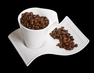 A cup of coffee beans isolated on black background