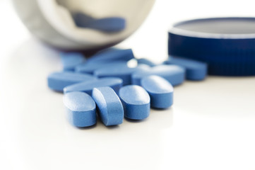 blue pills isolated in white bacground