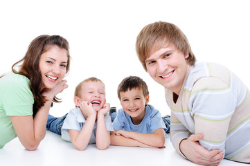 happy young family with two little sons