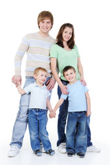 full-length portrait of young happy family