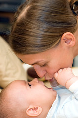 Mother kissing her child