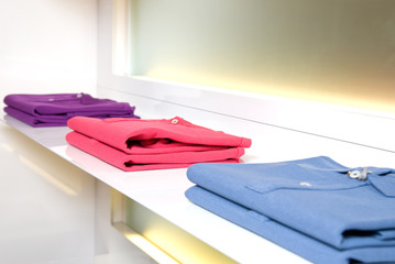 white store shelf with color clothes