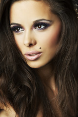 Naklejka premium sexy brunette girl on dark background - portrait