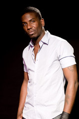 handsome black male smiling in studio portrait christian jones