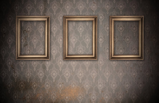 three vintage frames on dirty wall