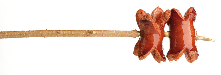 Grilled sausage on a stick