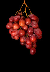 bunch of grapes on black background