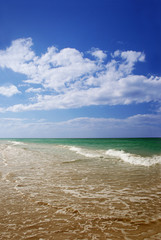 View of turquoise sea and sand beach