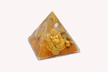 Pyramid with a gold figure inside
