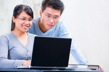Couple browsing internet at home