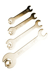 Spanners and nuts isolated on white background